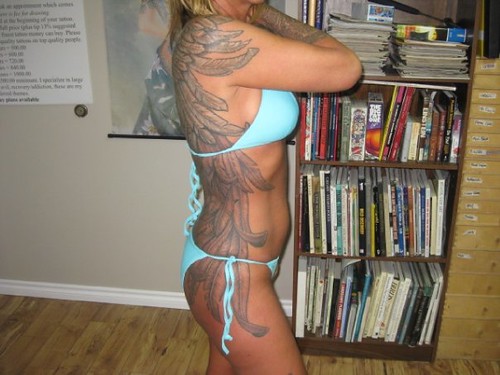 full back tattoo wings. Tattered wings full back piece