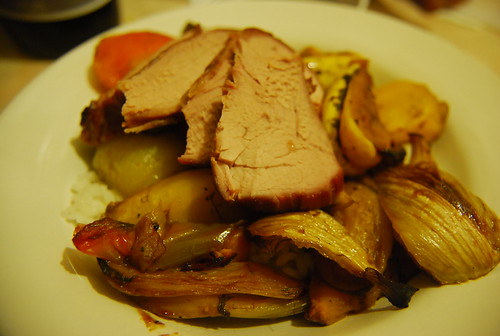 Pork tenderloin on roasted veggies and rice
