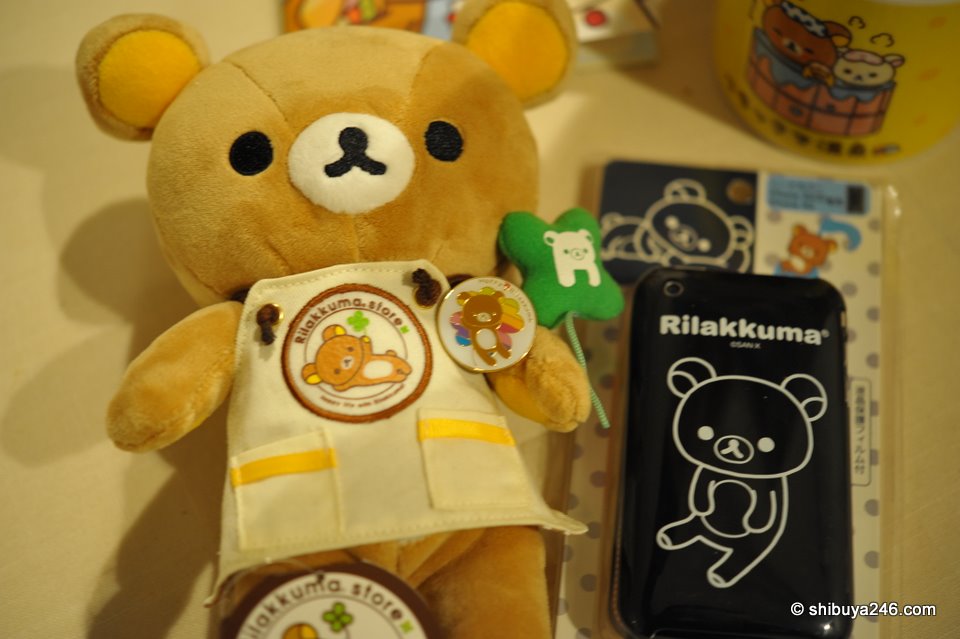 The back of the hard cover iPhone case has a full body design of Rilakkuma. The other 2 colors available just show the face. Apparently the black version is quite popular.