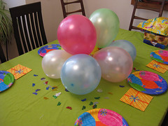 table with balloons and confetti, etc.