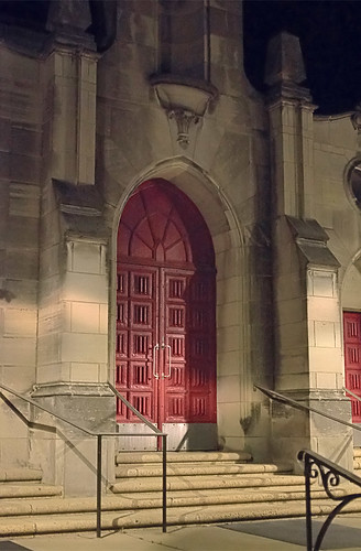 Little Flower Roman Catholic Church, in Richmond Heights, Missouri, USA - exterior door at night