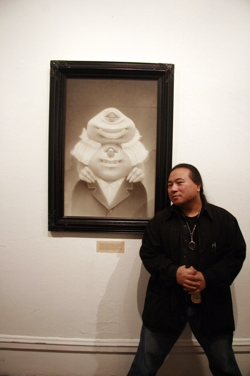 Travis Louie with his work