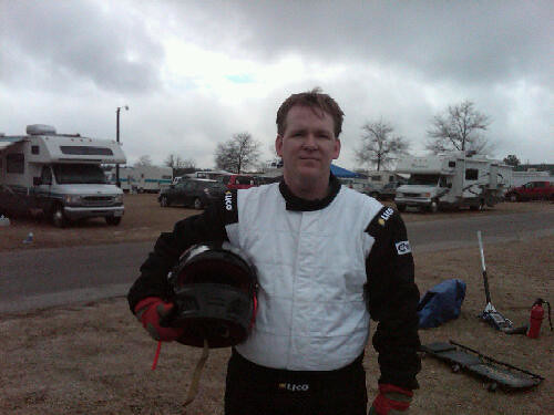 Greg in driving suit
