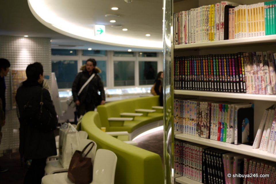 Nice combination of color at the Akiba:F Blood facility. Manga on the shelves with the more hospital style colorful and clean seating around the middle of the room.