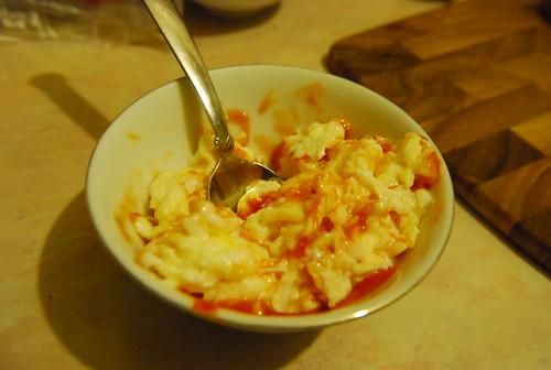 Scrambled eggs and Rooster sauce
