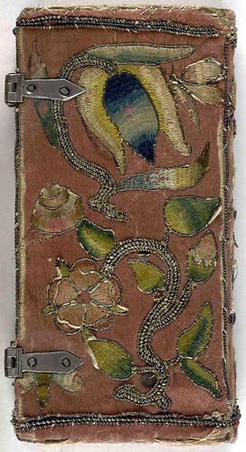 Back cover of 17th century embroidered satin book with two sets of metal clasps.
