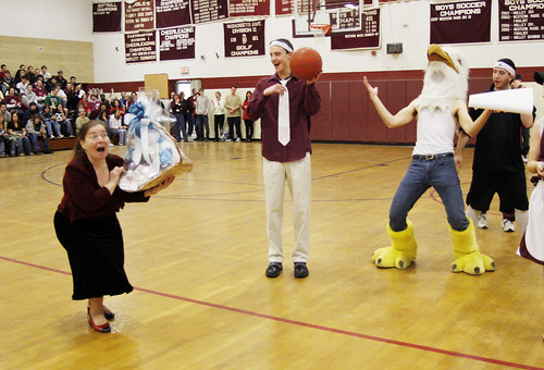 February 12, 2010 - Joan Bonsignore who was carrying the baskets around to show them to the crowd, wins the one in her hand during the raffle at Easthampton High School to benefit Haiti victims. 