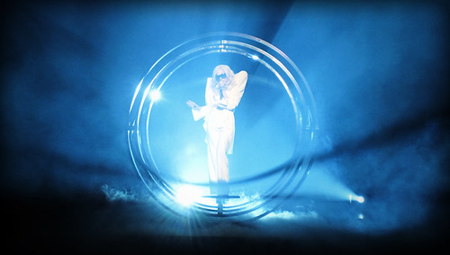 Lady Gaga in Vancouver: Lady Gaga performs inside a giant metal circle, lit with blue lights and surrounded by mist and smoke.