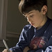 boy, with homework by woodleywonderworks, on Flickr