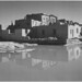 Full side view of adobe house with water in foreground, "Acoma Pueblo [National Historic Landmark, New Mexico]."