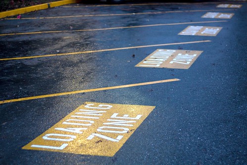 The conversion of 20 student parking spaces into yellow loading zones has made the already difficult campus parking situation even more troublesome for commuter students.  Photo by Alexander Crook/Foghorn