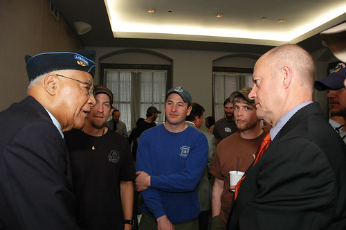Walter Morris a former 1st Sgt of the 555th Parachute Infantry Regiment Smoke Jumpers, speaks with Deputy Chief for Business Operations, U. S. Forest Service Chuck Myers. The Smoke Jumpers visited the the Forest Service on March 26, 2010 in Washington, D. C.