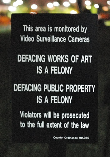 Sign - "Defacing works of art is a felony", in Chesterfield, Missouri, USA
