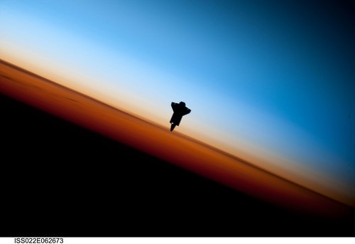 Space Shuttle Endeavour Over Earth (NASA, International Space Station Science, 02/09/10)  Though astronauts and cosmonauts often encounter striking scenes of Earths limb, this very unique image, part of a series over Earths colorful horizon, has the added feature of a silhouette of the space shuttle Endeavour. The image was photographed by an Expedition 22 crew member prior to STS-130 rendezvous and docking operations with the International Space Station. Docking occurred at 11:06 p.m. (CST) on Feb. 9, 2010. The orbital outpost was at 46.9 south latitude and 80.5 west longitude, over the South Pacific Ocean off the coast of southern Chile with an altitude of 183 nautical miles when the image of the was recorded. The orange layer is the troposphere, where all of the weather and clouds which we typically watch and experience are generated and contained. This orange layer gives way to the whitish Stratosphere and then into the Mesosphere. In some frames the black color is part of a window frame rather than the blackness of space.   Image and caption credit: NASA  Read full caption: <a href="http://spaceflight.nasa.gov/gallery/images/station/crew-22/html/iss022e062673.html" rel="nofollow">spaceflight.nasa.gov/gallery/images/station/crew-22/html/...</a>  More about the Crew Earth Observation experiment aboard the International Space Station: <a href="http://www.nasa.gov/mission_pages/station/science/experiments/CEO.html" rel="nofollow">www.nasa.gov/mission_pages/station/science/experiments/CE...</a>  More about space station science: <a href="http://www.nasa.gov/mission_pages/station/science/index.html" rel="nofollow">www.nasa.gov/mission_pages/station/science/index.html</a>  Theres a Flickr group about Space Station Science. Please feel welcome to join! <a href="http://www.flickr.com/groups/stationscience/">www.flickr.com/groups/stationscience/</a>