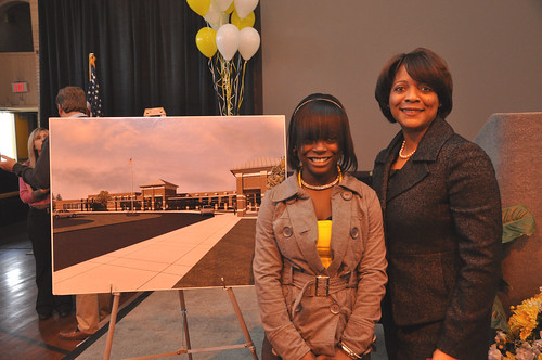 Former Dillon School student Ty'Sheoma Bethea, (L) who wrote a letter about the condition of her school to  President Obama, stands with Rural Development South Carolina State Director Vernita Dore next to a drawing of a new school building funded with Recovery Act loan and grant funds provided through USDA. 