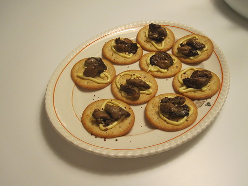 Smoked oysters on crackers with Kewpie and merlot salt