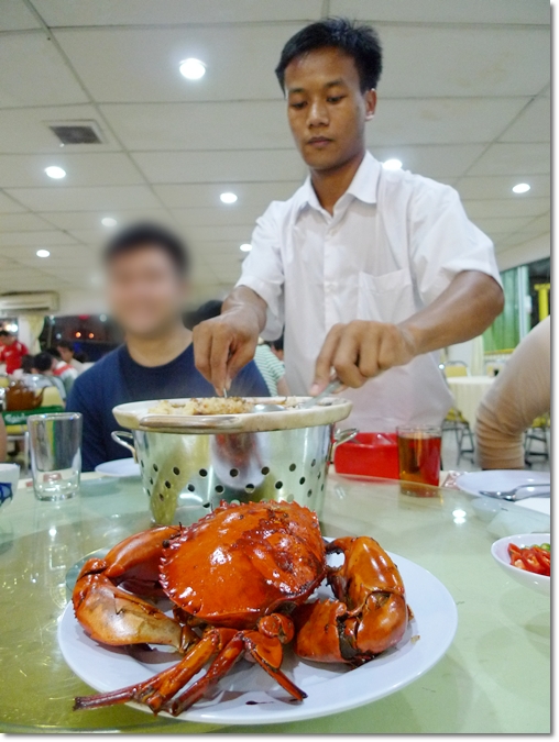 Serving the Claypot Crab Rice