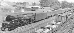 Pennsylvania Railroad T1 Duplex steam locomotive on a passenger train. Homewood Illinois circa 1940's.