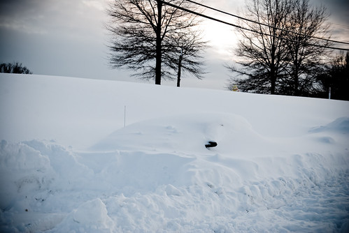 Car buried in 33 inches of snow