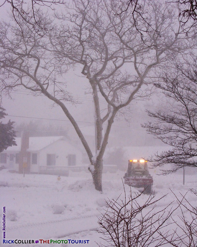 A Rehoboth Beach city worker struggles to keep the road open in the teeth of the blizzard of 2010.
