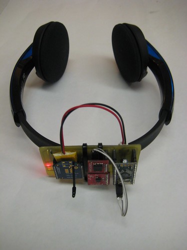 [Redefining 5.1's head tracking system mounted on Bluetooth–enabled headphones.]