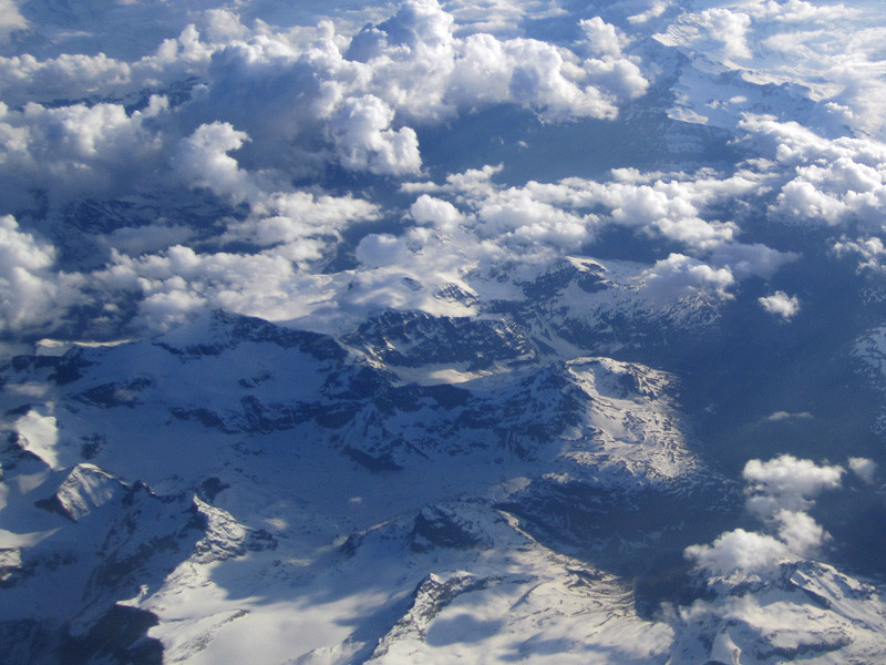 swiss alps and clouds