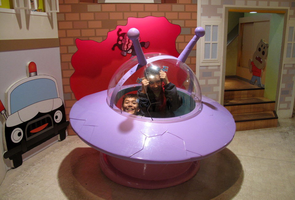 My nephews trying out the alien spaceship in the display.