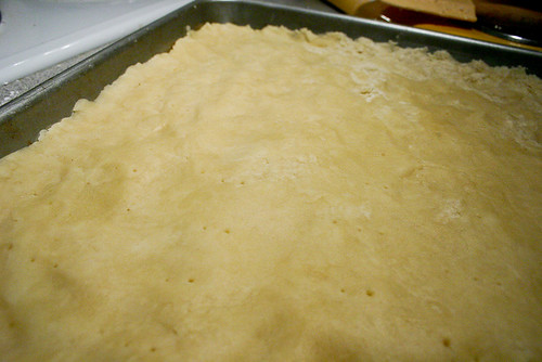Press dough into cookie sheet