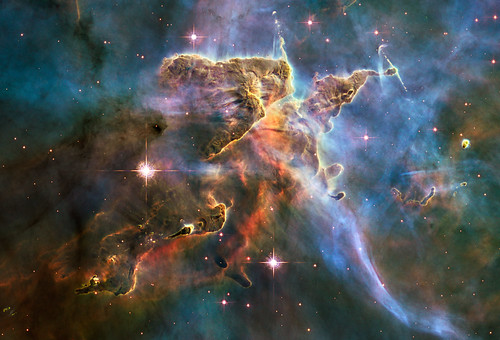 Hubble Captures Spectacular "Landscape" in the Carina Nebula NASA image release April 22, 2010  NASAs Hubble Space Telescope captured this billowing cloud of cold interstellar gas and dust rising from a tempestuous stellar nursery located in the Carina Nebula, 7,500 light-years away in the southern constellation Carina. This pillar of dust and gas serves as an incubator for new stars and is teeming with new star-forming activity. Hot, young stars erode and sculpt the clouds into this fantasy landscape by sending out thick stellar winds and scorching ultraviolet radiation. The low-density regions of the nebula are shredded while the denser parts resist erosion and remain as thick pillars. In the dark, cold interiors of these columns new stars continue to form. In the process of star formation, a disk around the proto-star slowly accretes onto the stars surface. Part of the material is ejected along jets perpendicular to the accretion disk. The jets have speeds of several hundreds of miles per second. As these jets plow into the surround nebula, they create small, glowing patches of nebulosity, called Herbig-Haro (HH) objects.  Long streamers of gas can be seen shooting in opposite directions off the pedestal on the upper right-hand side of the image. Another pair of jets is visible in a peak near the top-center of the image. These jets (known as HH 901 and HH 902, respectively) are common signatures of the births of new stars. This image celebrates the 20th anniversary of Hubbles launch and deployment into an orbit around Earth. Hubbles Wide Field Camera 3 observed the pillar on Feb. 1-2, 2010. The colors in this composite image correspond to the glow of oxygen (blue), hydrogen and nitrogen (green), and sulfur (red). Object Names: HH 901, HH 902 Image Type: Astronomical  Credit: NASA, ESA, and M. Livio and the Hubble 20th Anniversary Team (STScI)  To read learn more about this image go to:  <a href="http://www.nasa.gov/mission_pages/hubble/science/hubble20th-img.html" rel="nofollow">www.nasa.gov/mission_pages/hubble/science/hubble20th-img....</a>  <b><a href="http://www.nasa.gov/centers/goddard/home/index.html" rel="nofollow">NASA Goddard Space Flight Center</a></b>  is home to the nations largest organization of combined scientists, engineers and technologists that build spacecraft, instruments and new technology to study the Earth, the sun, our solar system, and the universe.