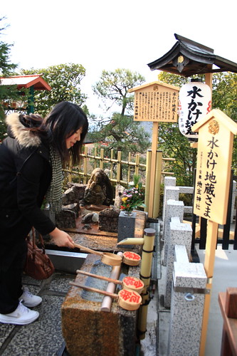 Japanese gals wishing for love luck in Kiyomizu temple