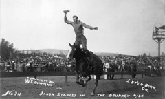 Cowboy Jason Stanley performing a riding trick...