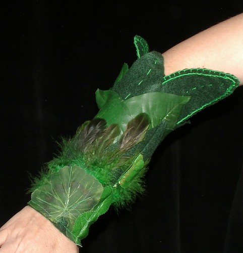 sleeve of ghreen leaves and green feathers