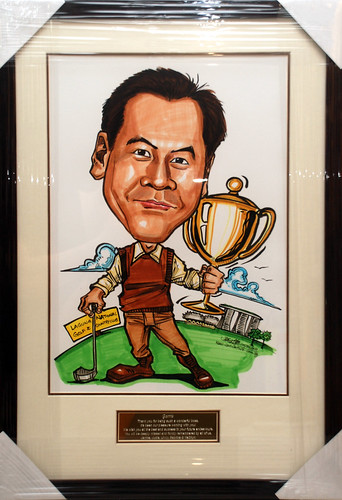 Golfer caricature with trophy framed with engraving plate