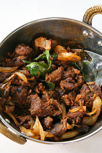 Erachi Ularthiyathu - Tender mutton roasted with garam masala and diced coconut