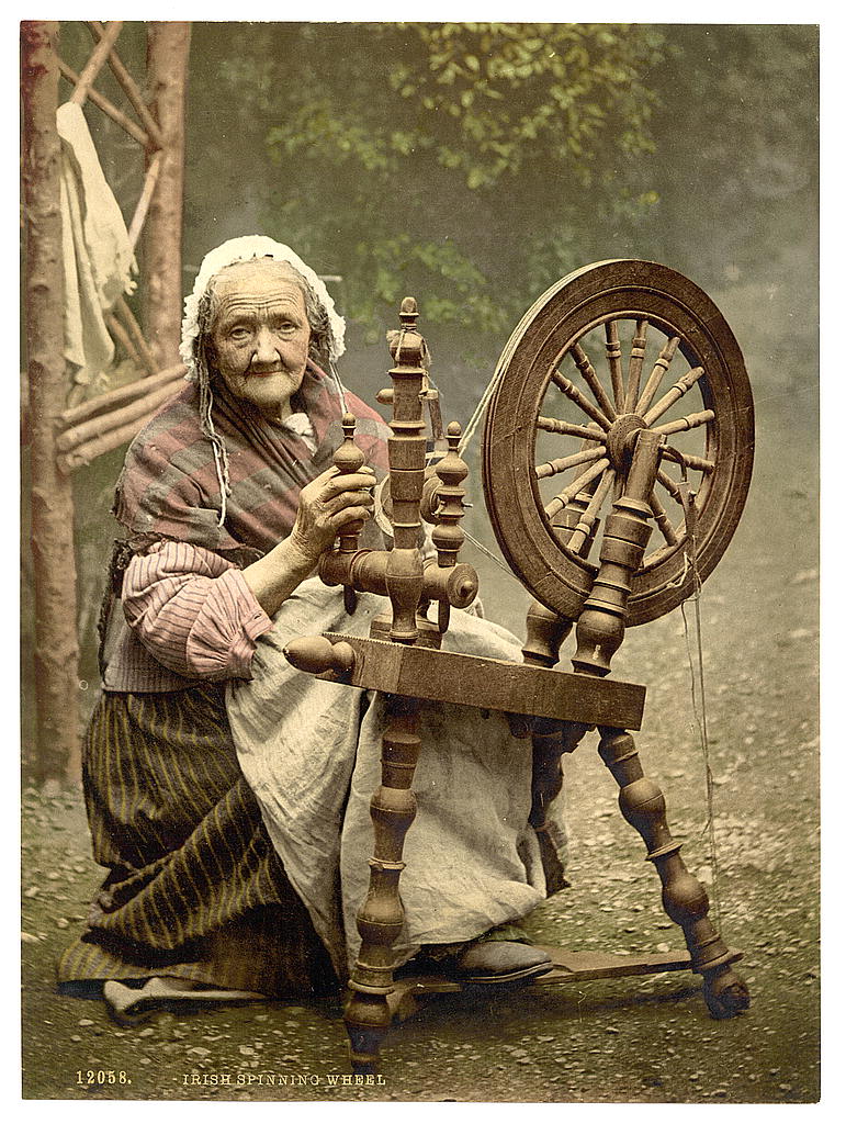 Irish spinner and spinning wheel. County Galway, Ireland