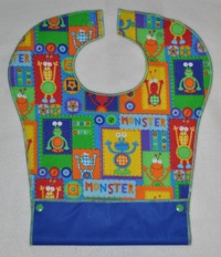 Monster Squares Toddler Pocket Bib with blue PUL backing