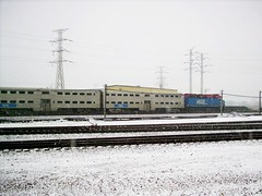 A westbound Metra commuter train passes by during a morning snowstorm. Chicago Illinois. December 2007.