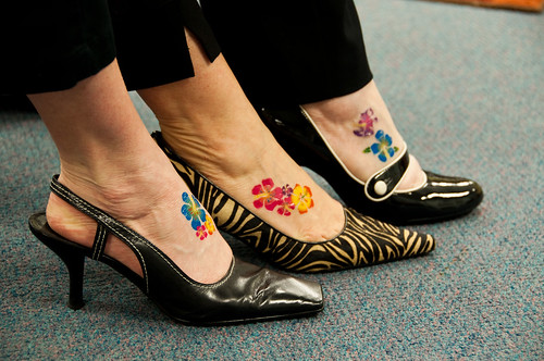cute flower tattoos. flowers on foot tattoo
