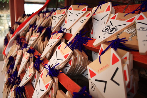 Fox faces with wishes in the Fushimi Inari Shrine