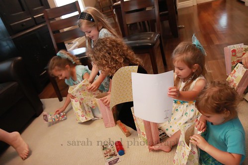. the girls opening their goodie bags .