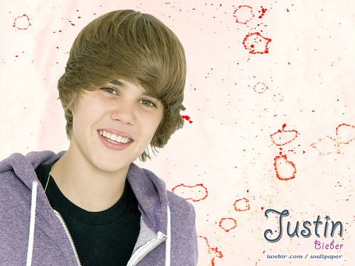 background pictures of justin bieber. justin bieber smiles nicely