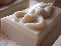 ivory coloured lily scented soap in the shape of a goddess with her arms raised