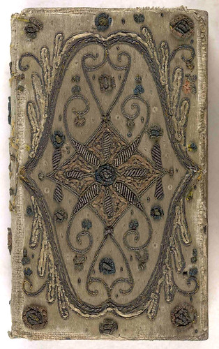 17th century embroidered satin book cover with silver threads.