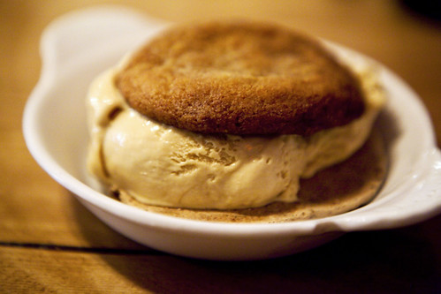 Gingersnap and walnut meringue cookies with salted caramel ice cream sandwich