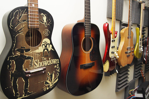 February 16, 2010 - A row of guitars and other instruments line the wall at Henry's home in Shutesbury.
