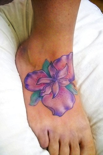 Iris Tattoos Design on Women Leg Posted by Dono at 549 PM