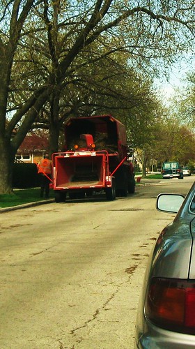 Village of Elmwood Park Department of Public Works crew with a mobile woodchipper machine. Elmwood Park Illinois. Early April 2010.