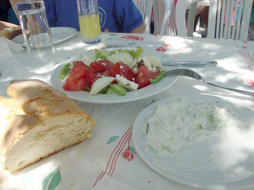 greek salad meal with tzatziki and bread