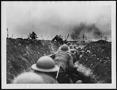 Officer leads the way amidst the bursting of German shells