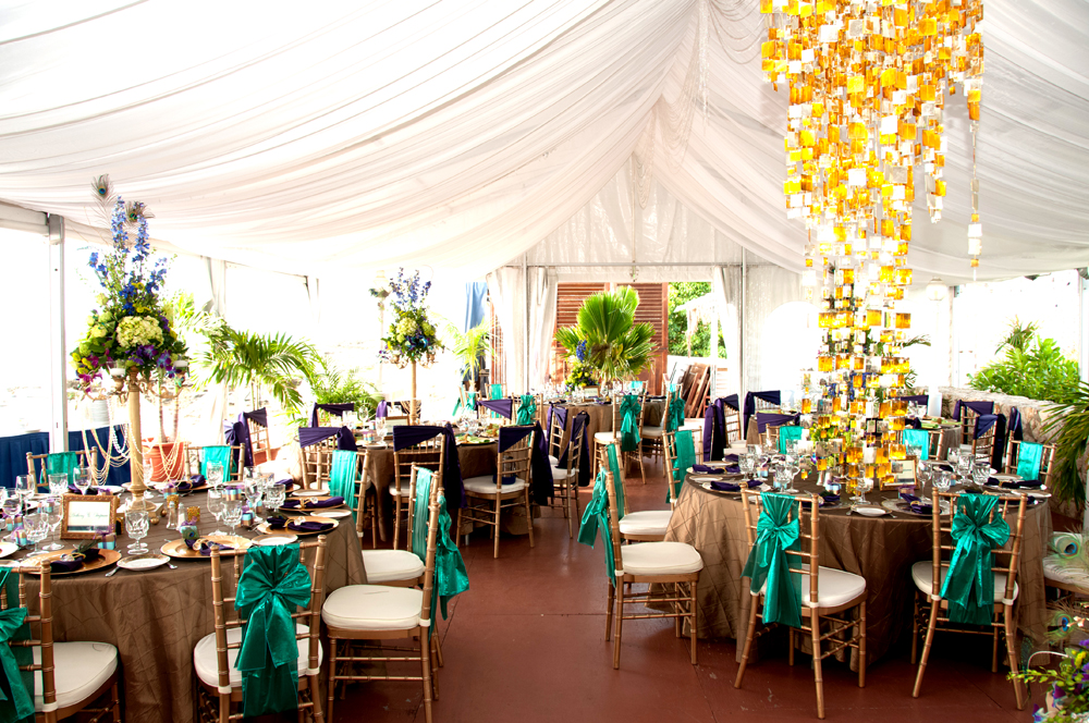 The tablescape comprised of towering gold candelabras filled with lime green